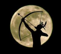 Ad Astra statue against full moon